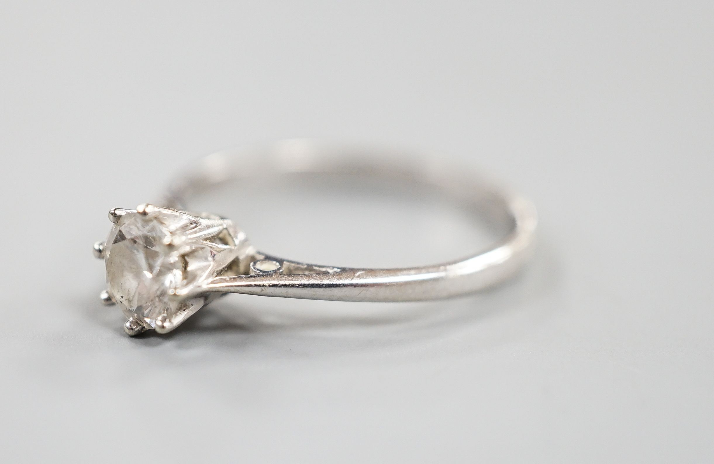 A modern 18ct white gold and solitaire diamond ring, size N, gross weight 2.2 grams, the stone measuring 5.2mm in diameter.